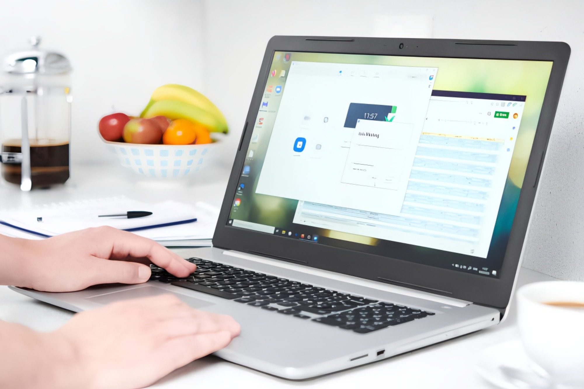 Person using a laptop with a financial or business dashboard open.
