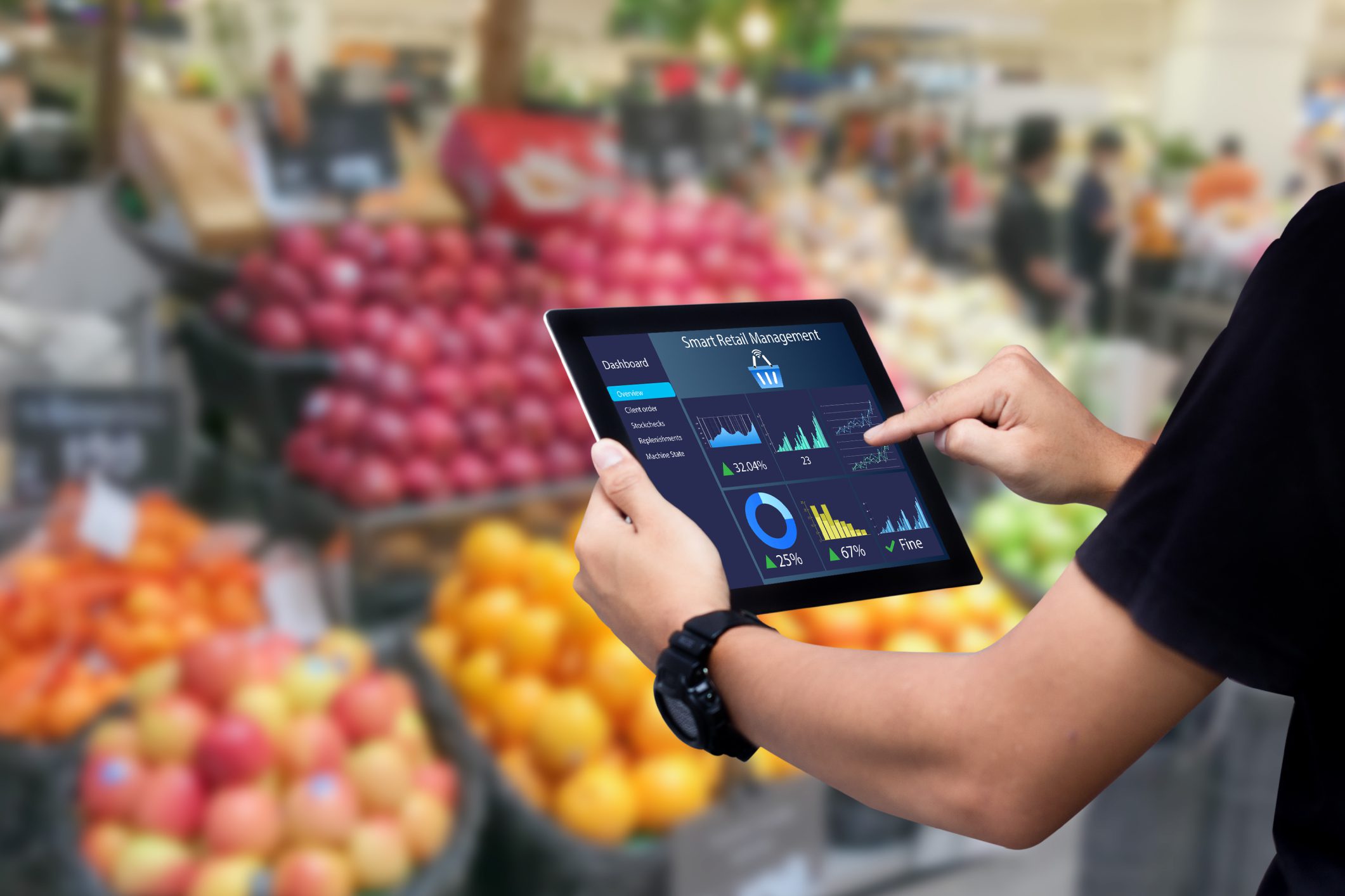 Person using tablet in grocery store.