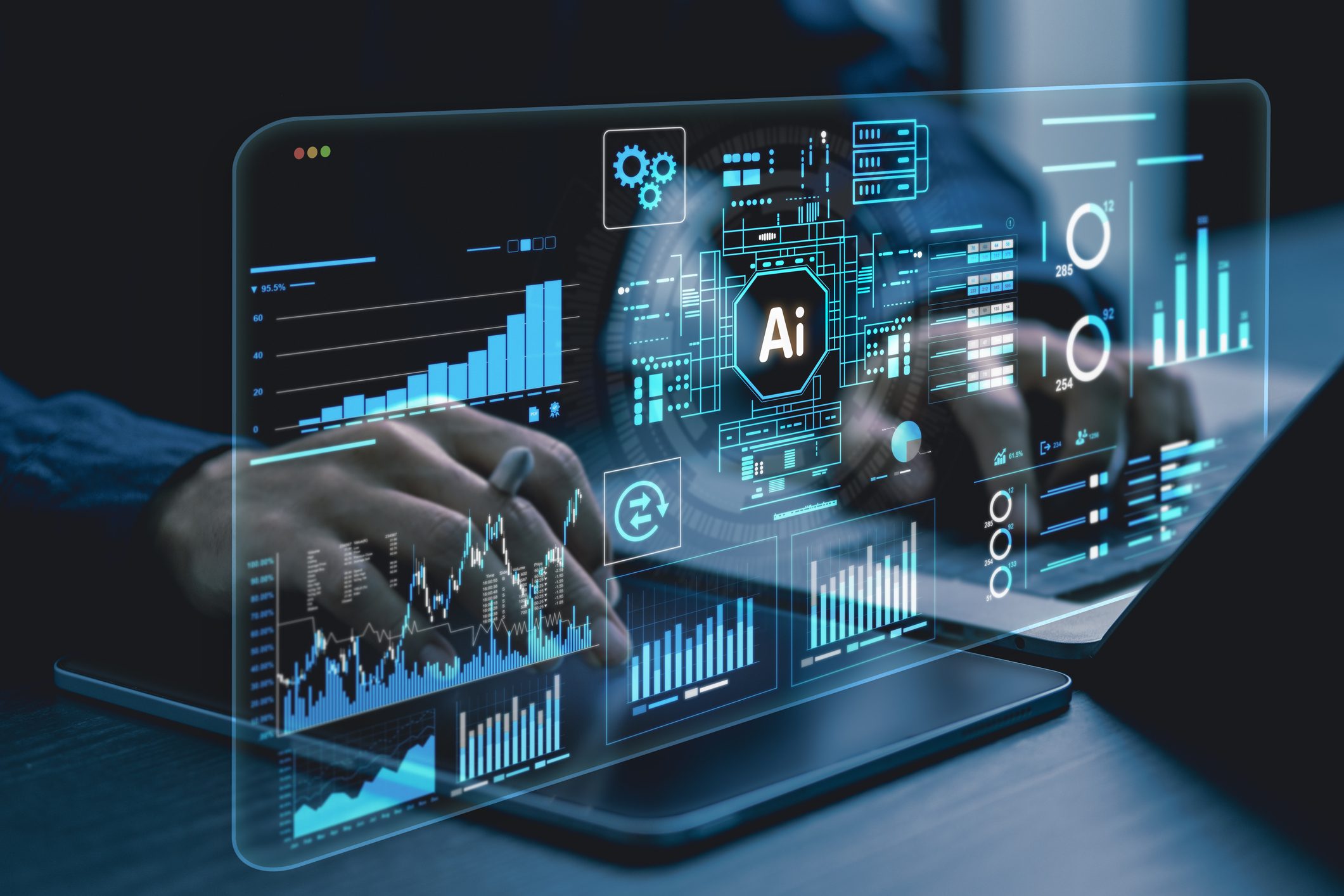 Hands interacting with a laptop displaying AI and data analytics visuals.