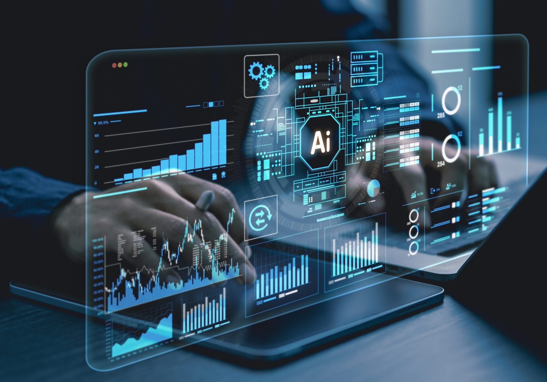 Hands interacting with a laptop displaying AI and data analytics visuals.